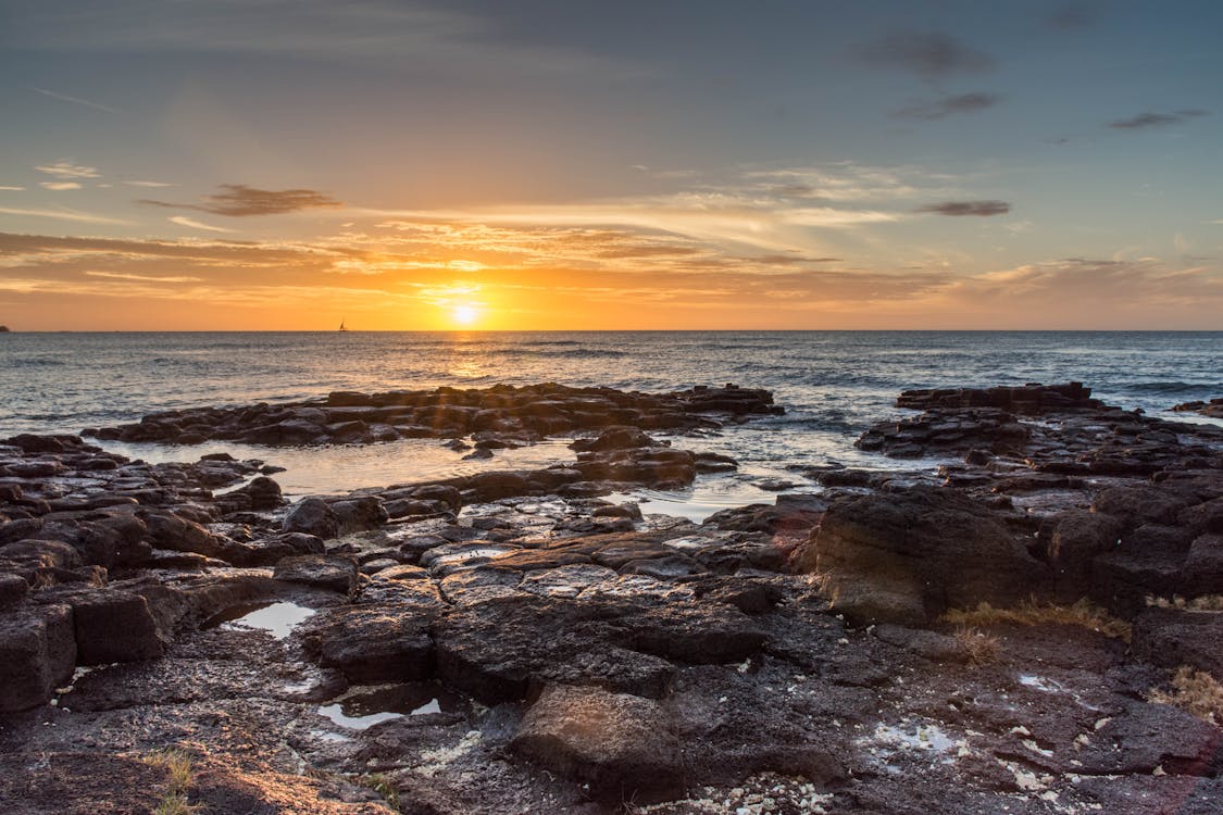 Sea Under White Clouds during Golden Hour