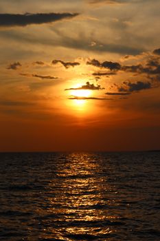 Gorgeous sunset over the shimmering ocean waters in Canada, capturing a serene and warm atmosphere.