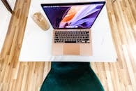 A Cup of Iced Coffee beside a Laptop