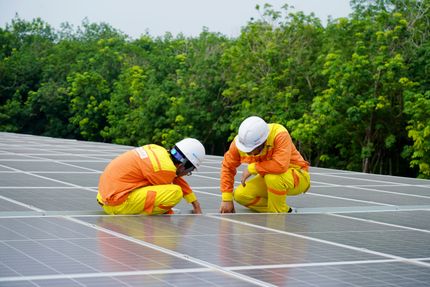 Workers installing photovoltaic panels
