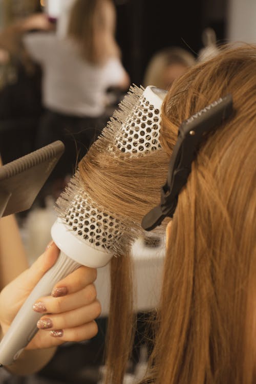 Close-up of Curling Woman Hair on Round Brush