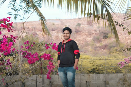 Indian Boy Smiling Surrounded With  Mountains