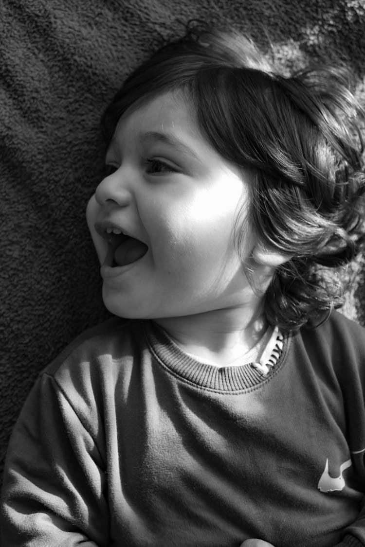 Grayscale Photo Of A Toddler