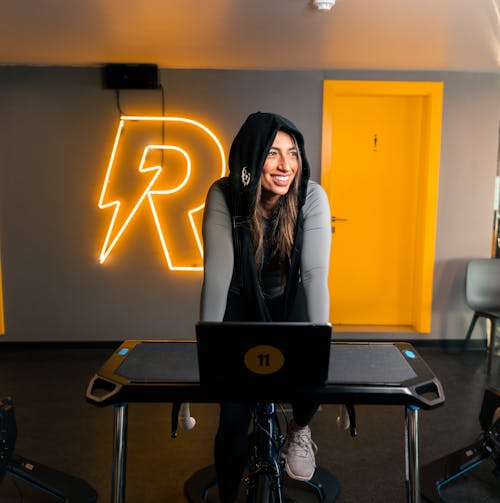 Woman Riding Stationary Bike