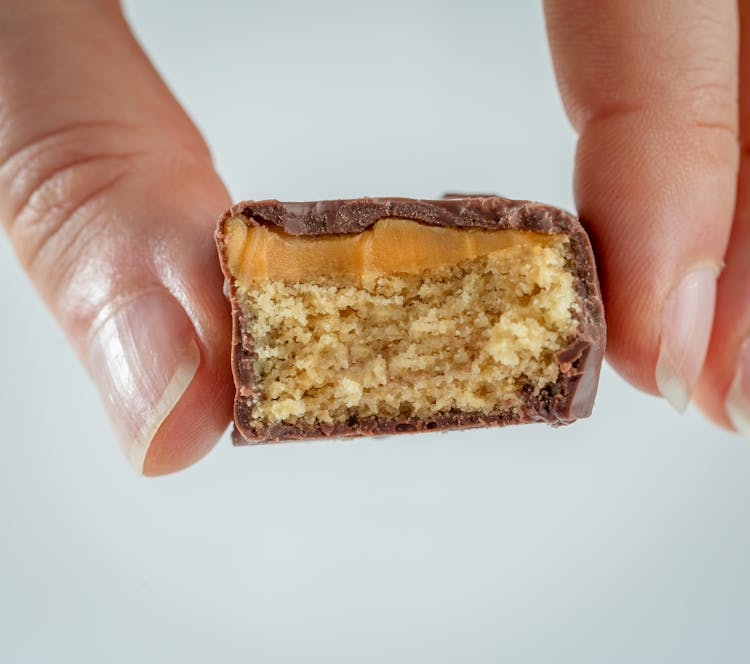 A Person Holding Chocolate Bar