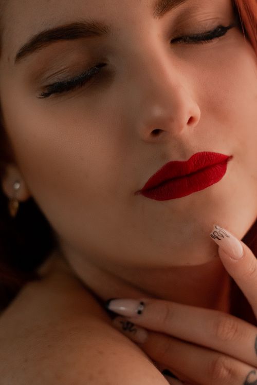 A Woman with Red Lips while Eyes Closed · Free Stock Photo