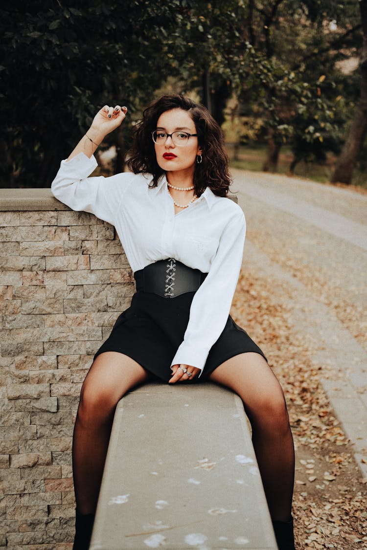 Woman In Shirt Posing On Wall