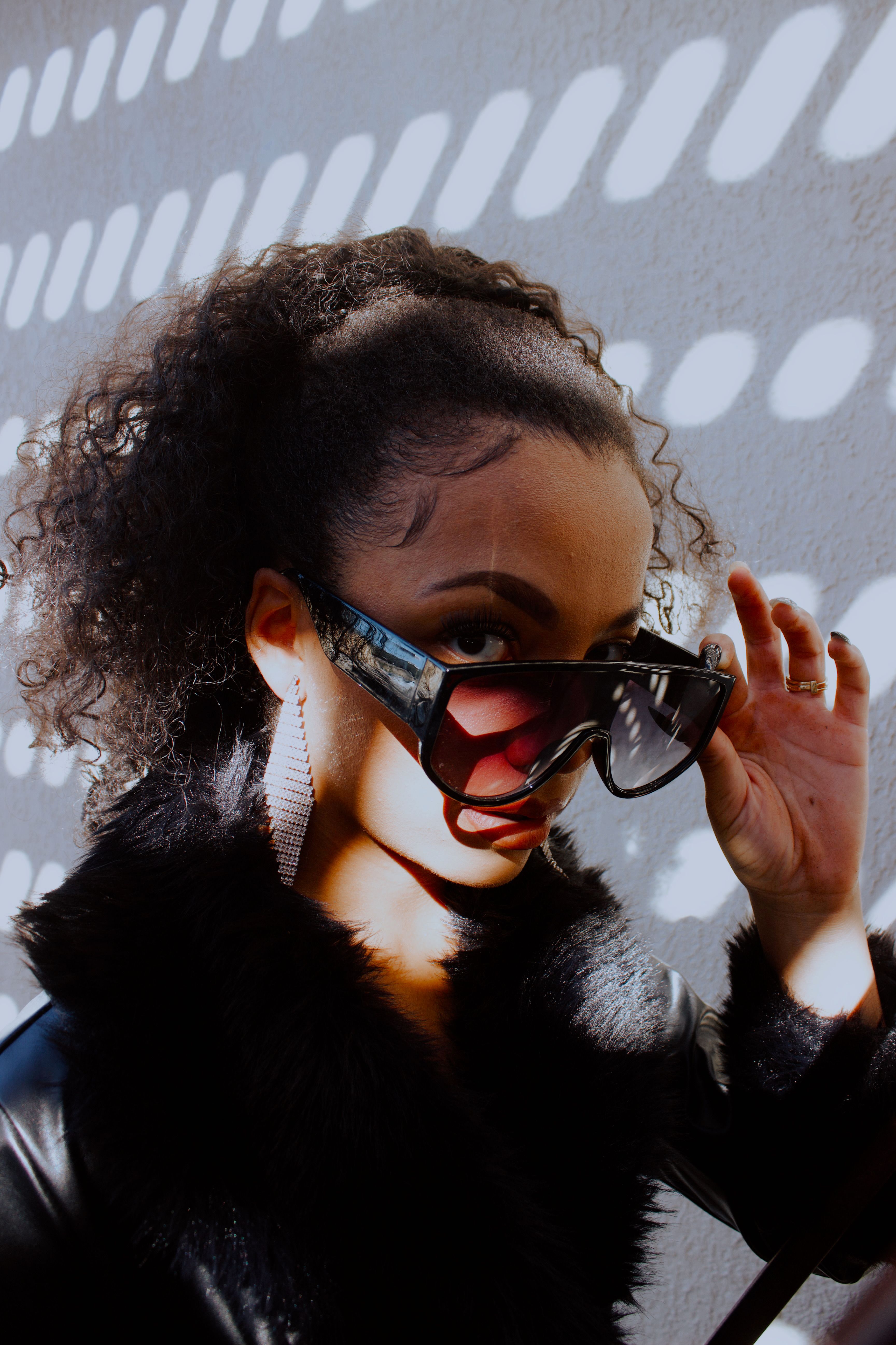 A Woman Wearing Black Sunglasses · Free Stock Photo
