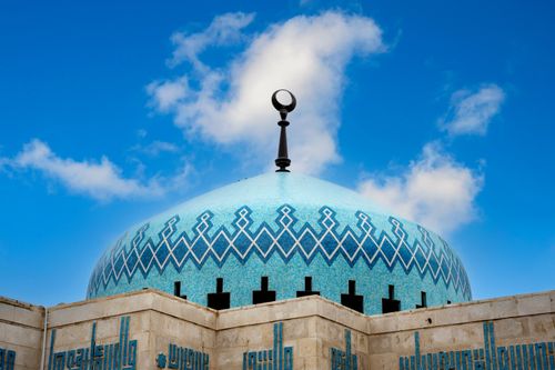 Free Striking blue dome of King Abdullah I Mosque against a clear sky in Amman, Jordan. Stock Photo