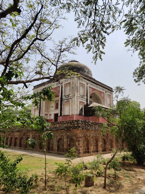 Free A beautiful historic structure located in Sunder Nursery, surrounded by lush greenery in New Delhi, India. Stock Photo