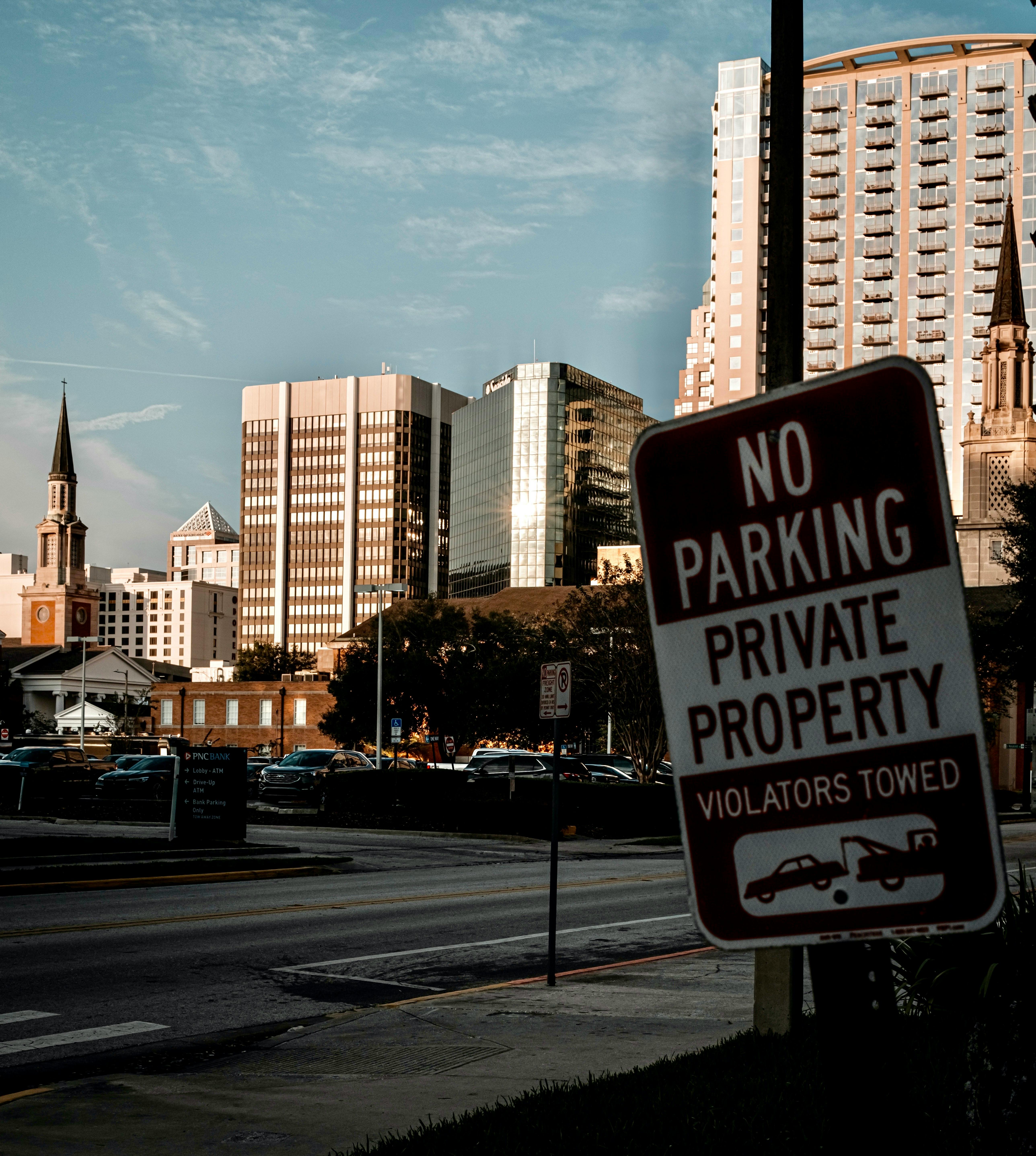 a no parking sign on a street corner