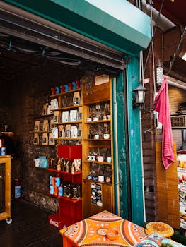 A charming coffee shop display with bags, mugs, and decor for sale. Cozy and inviting atmosphere.
