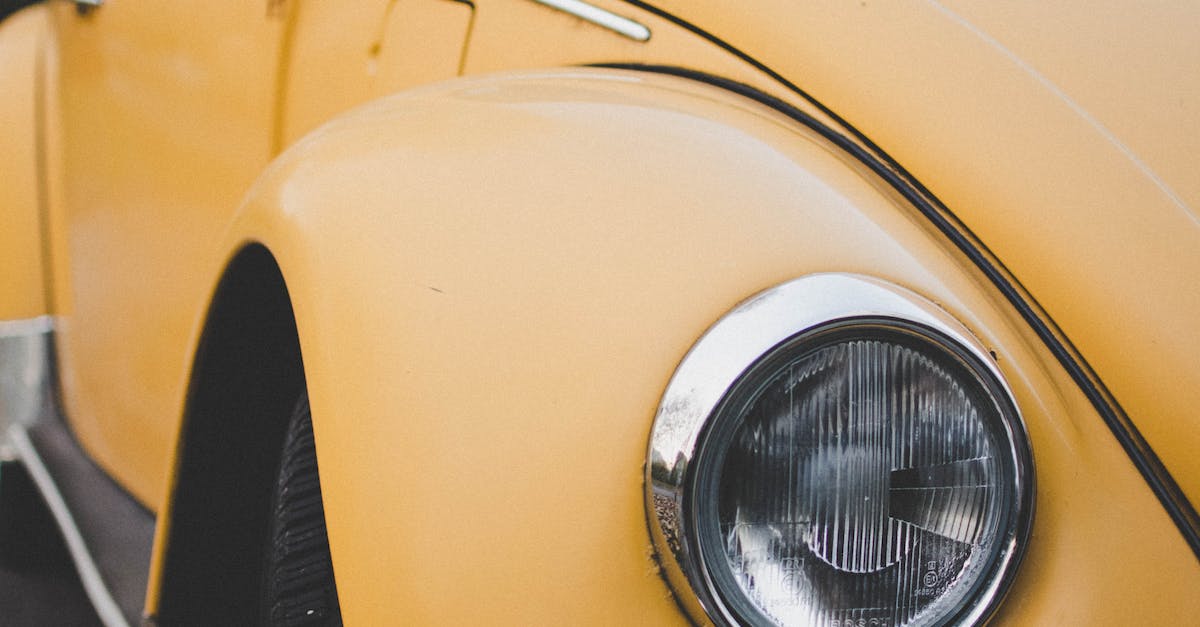 Yellow Volkswagen Beetle Coupe Parked on Gray Concrete Surface
