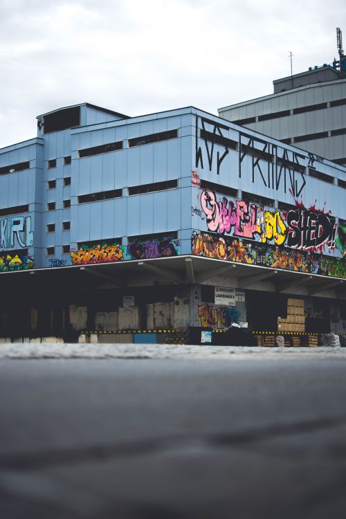 Free Colorful street art covering a large building facade in Liezen, Austria. Stock Photo
