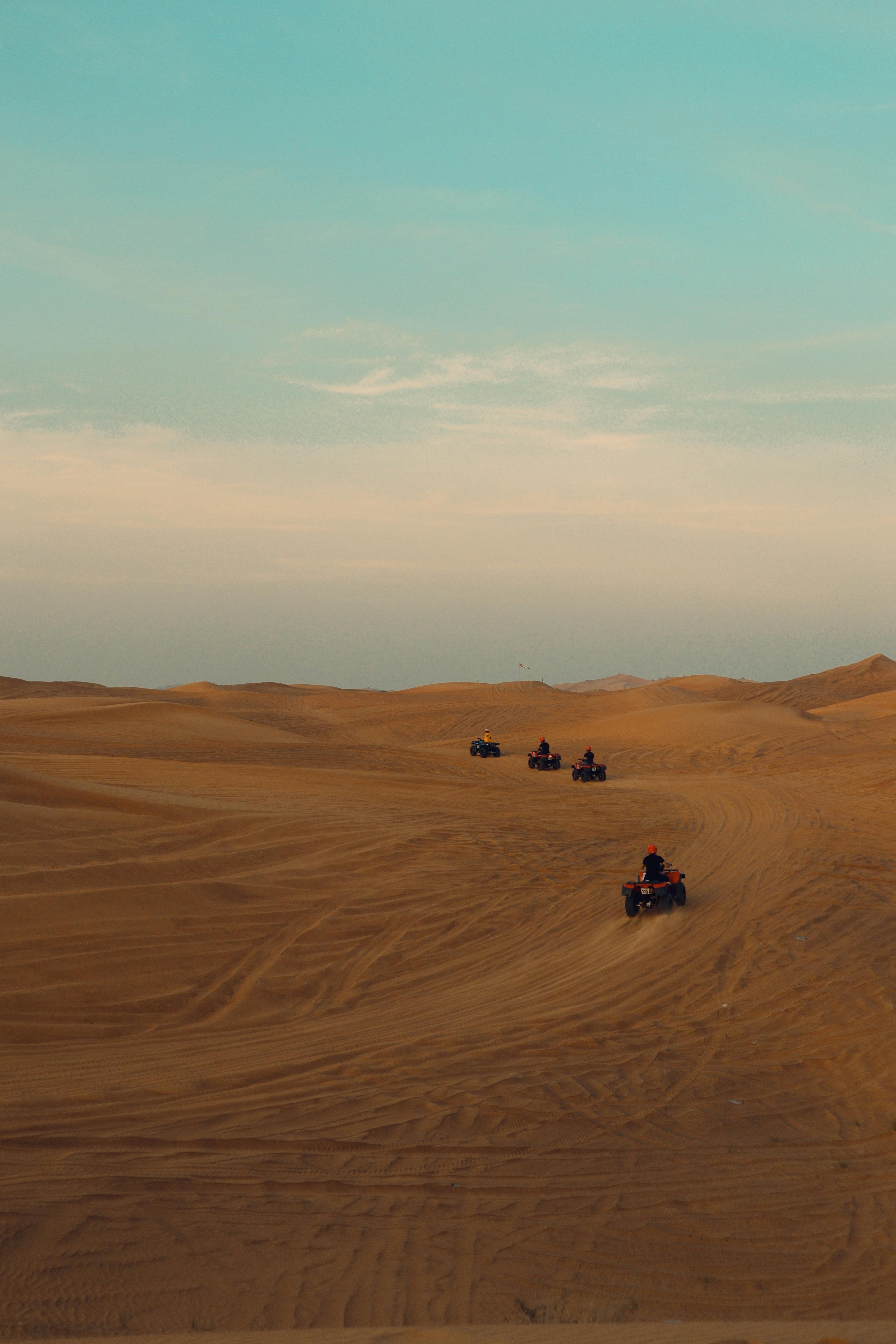 Quads Driving in Sand Dunes · Free Stock Photo