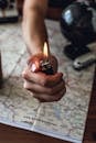 Person Holding Black Disposable Lighter