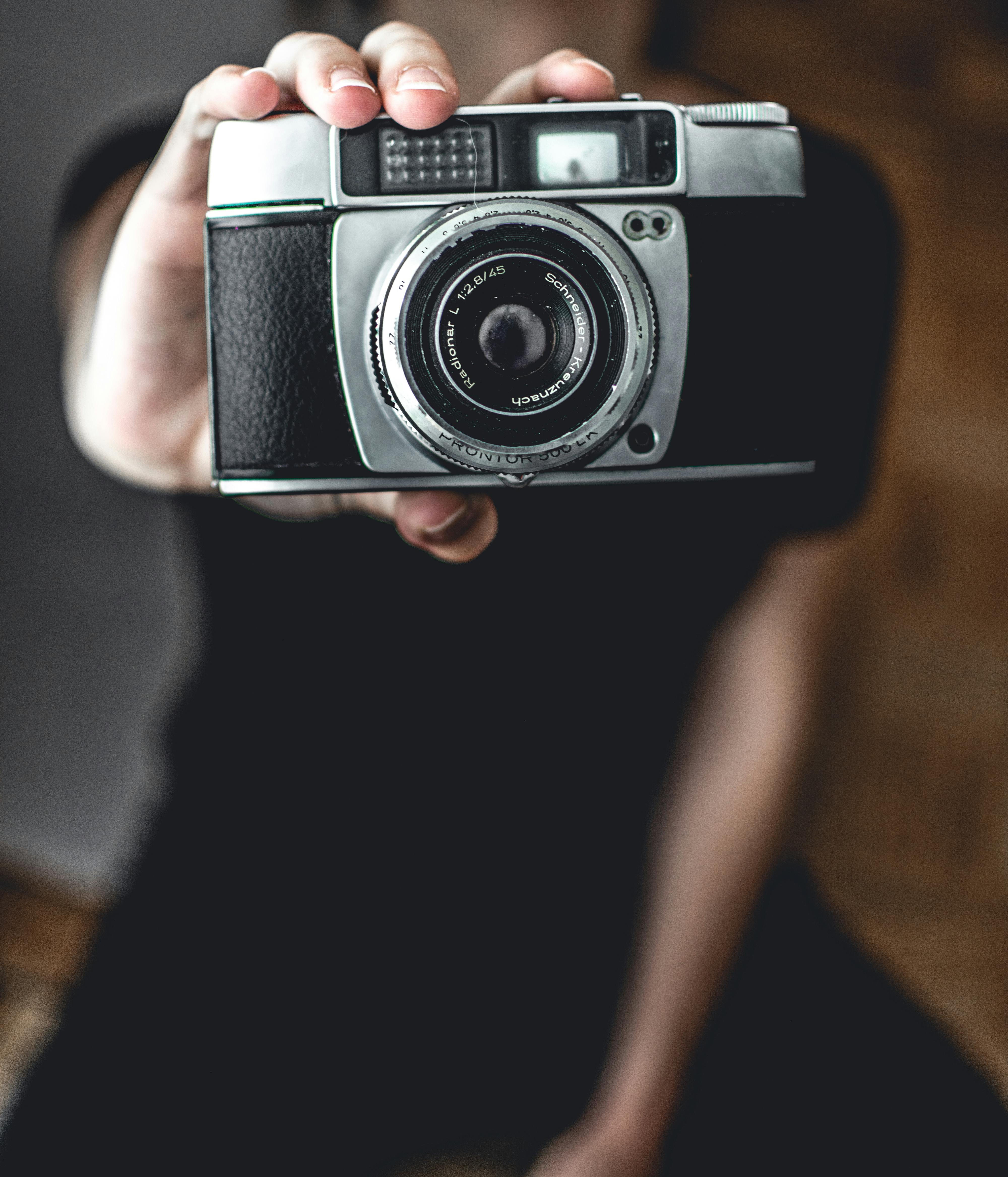 Person Holding Camera · Free Stock Photo