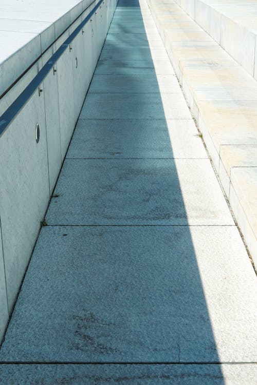 Shadow on Concrete Path