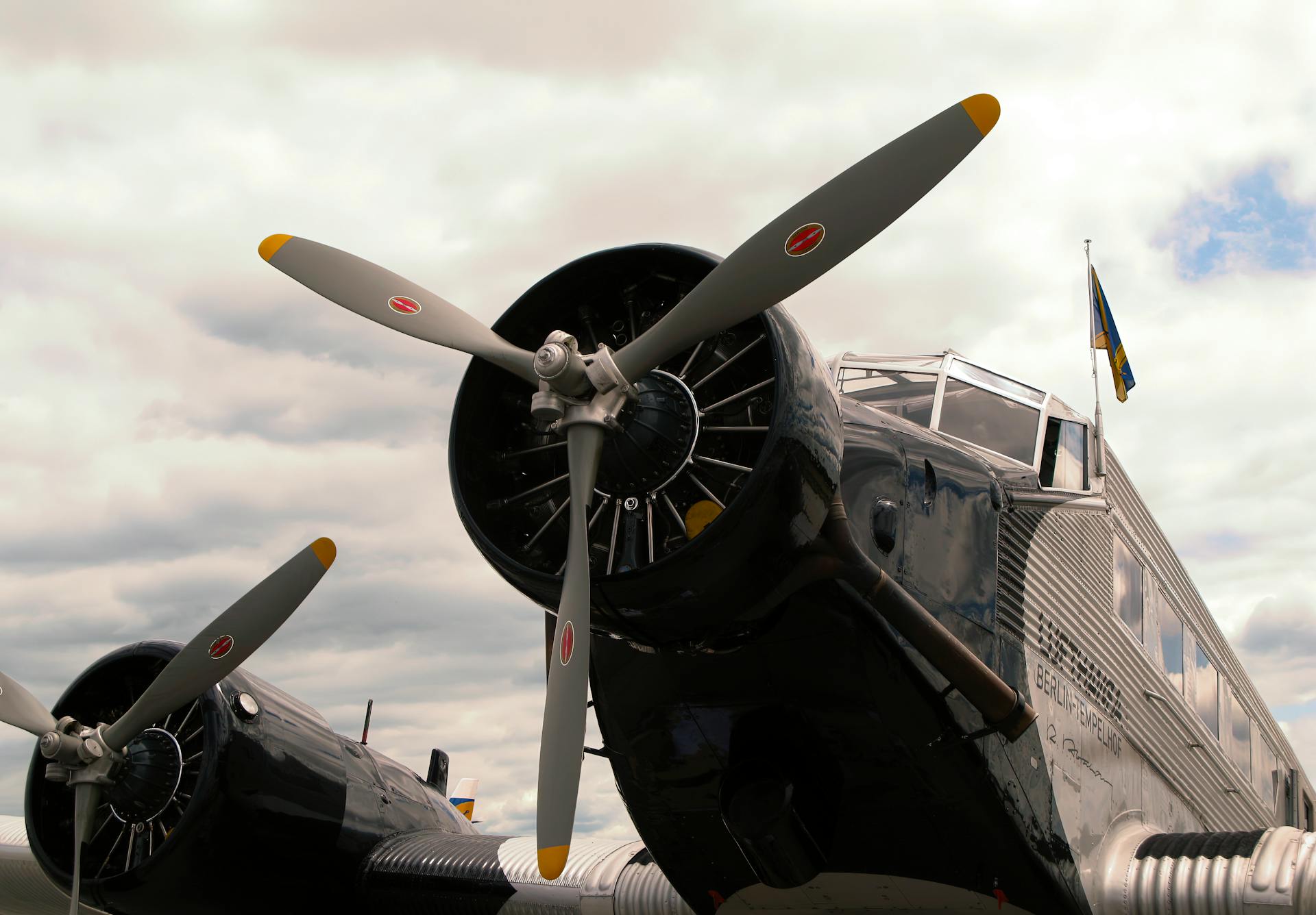 Historic Junkers Ju 52 aircraft on display with propellers, showcasing vintage aviation design.
