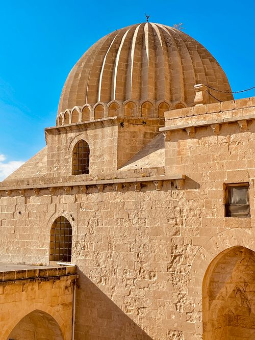 Free Beautiful stone building featuring a prominent dome under a clear blue sky. Stock Photo