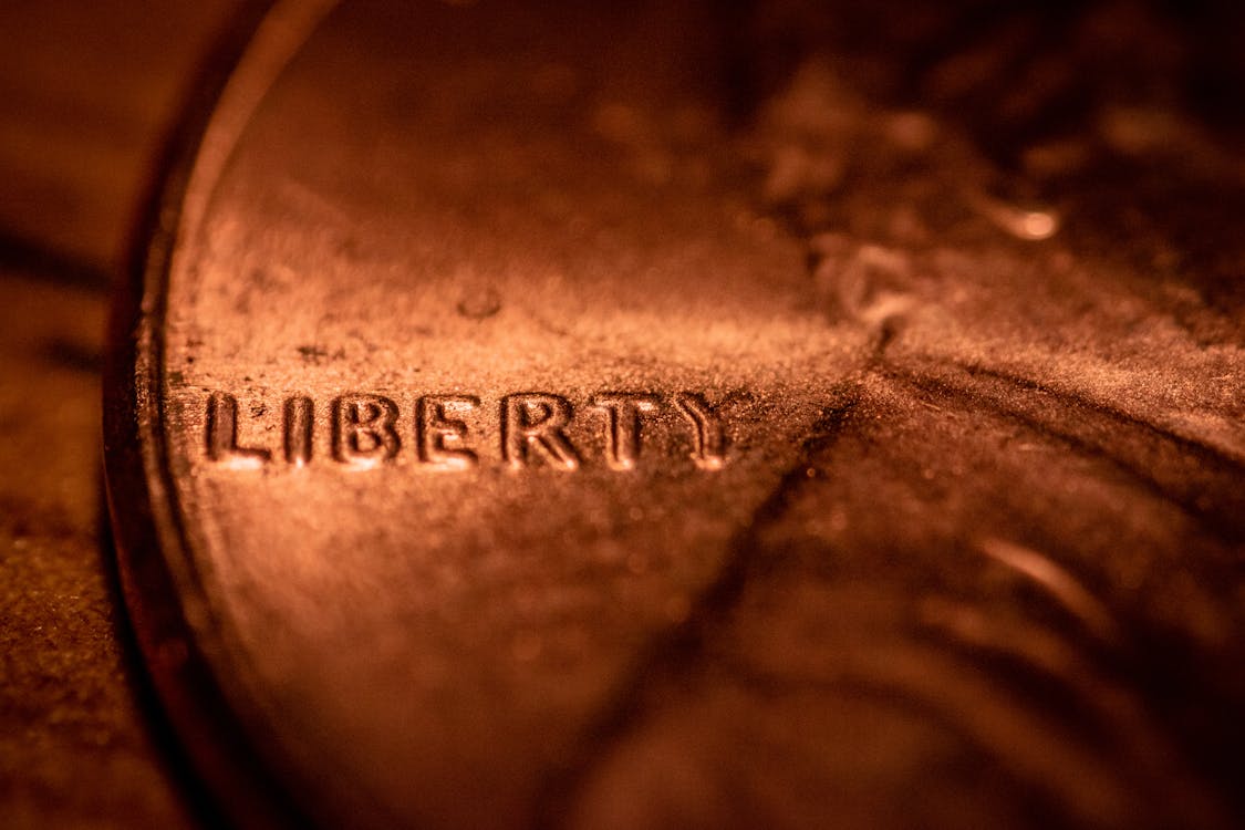 Free Liberty title with depicted profile of man on coin Stock Photo