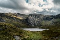 Lake Surrounded By Mountain