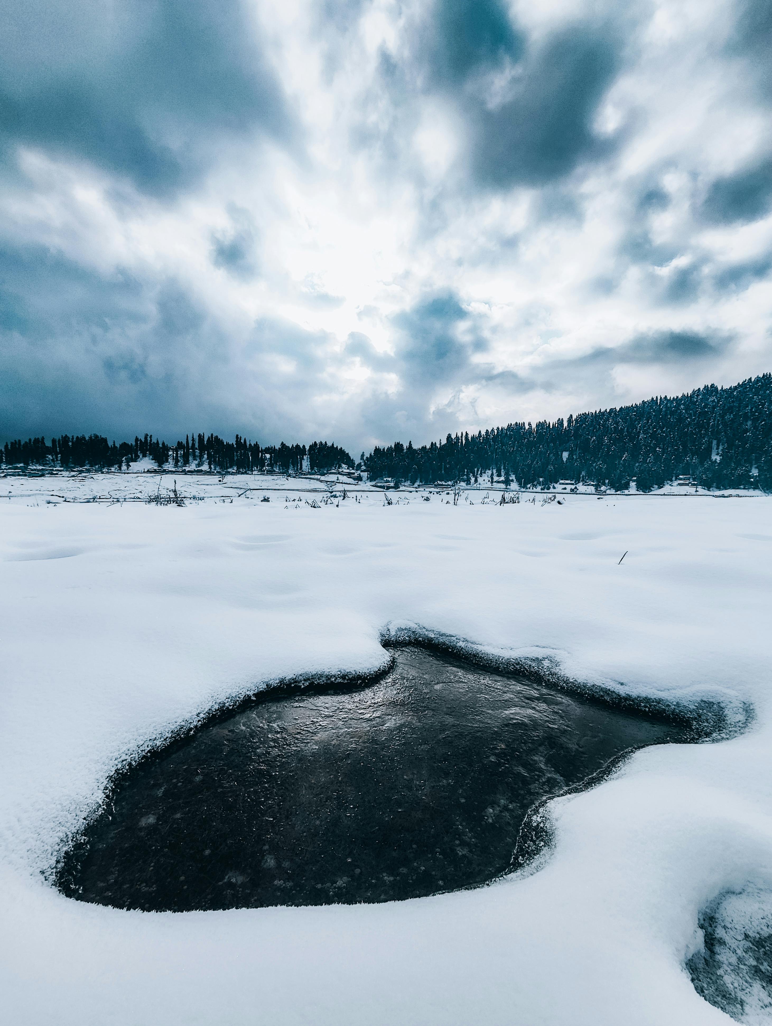 Boats in a frozen lake in winter time - a Royalty Free Stock Photo from  Photocase