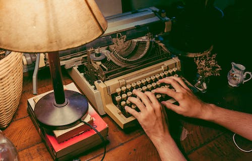 Free Person Typing On Typewriter Stock Photo