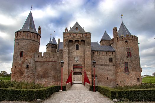 Explore the grandeur of Muider Castle's gothic architecture in Muiden, Netherlands. A stunning medieval landmark., free online jigsaw puzzle on JigsawPuzzlesFreeOnline.org