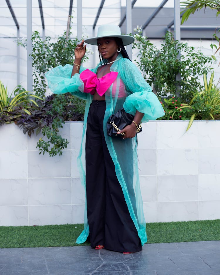 Woman Posing In Dress And Hat