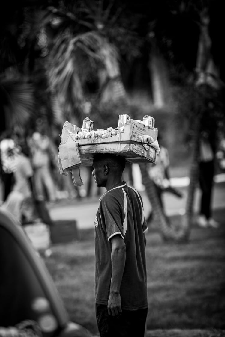 Man Carrying Box On Head