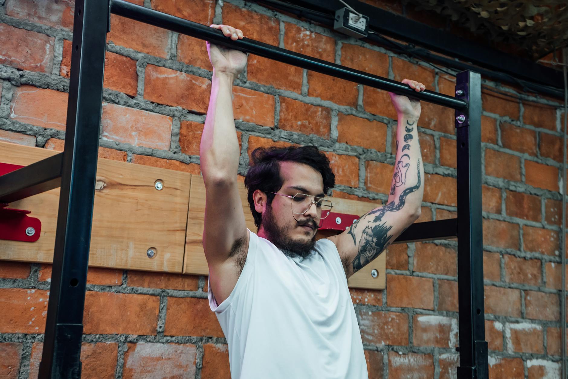 Revolutionize Your Fitness Routine with These 5 Mind-Blowing Wall Mount Exercise Equipment Ideas 4 https://www.pexels.com/photo/a-man-working-out-14623676/