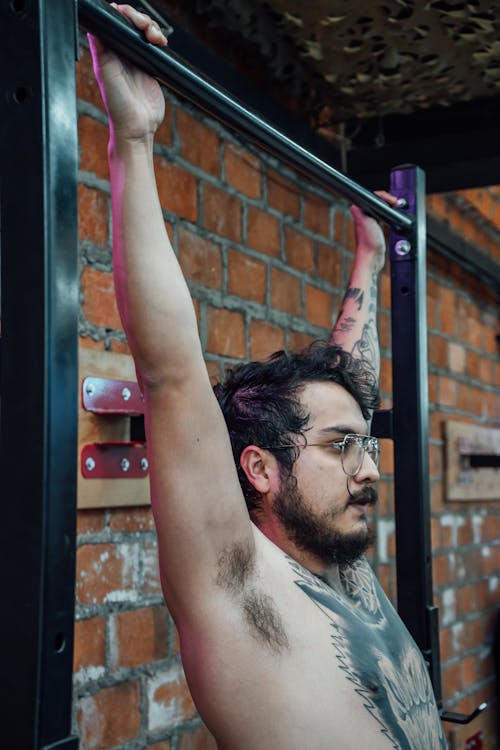 A Shirtless Man Working Out 