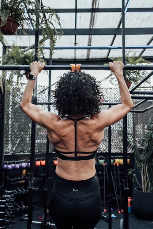 Free A Woman Doing Pull Ups  Stock Photo