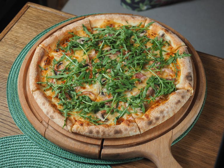 Pizza On Wooden Board