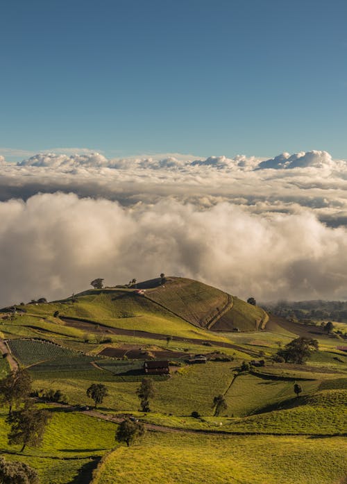 丘陵, 垂直拍摄, 多雲的天空 的 免费素材图片