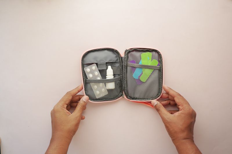 Portable home first aid kit with bandages and everyday essentials