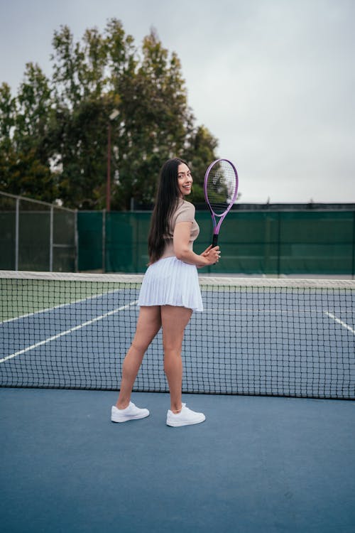 A Woman Holding a Tennis Racket 