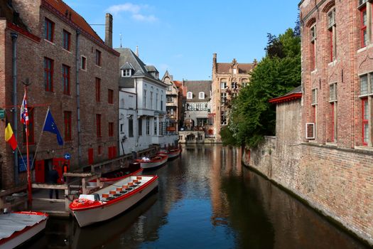 Pre-dawn canal row with a photographer — Bruges