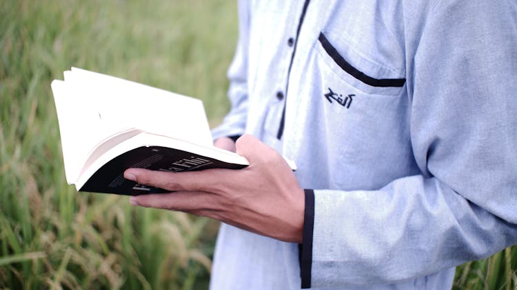 A Person Reading A Book