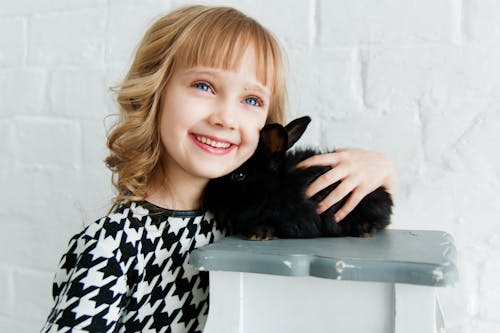 Free Girl Holding Black Rabbit Stock Photo