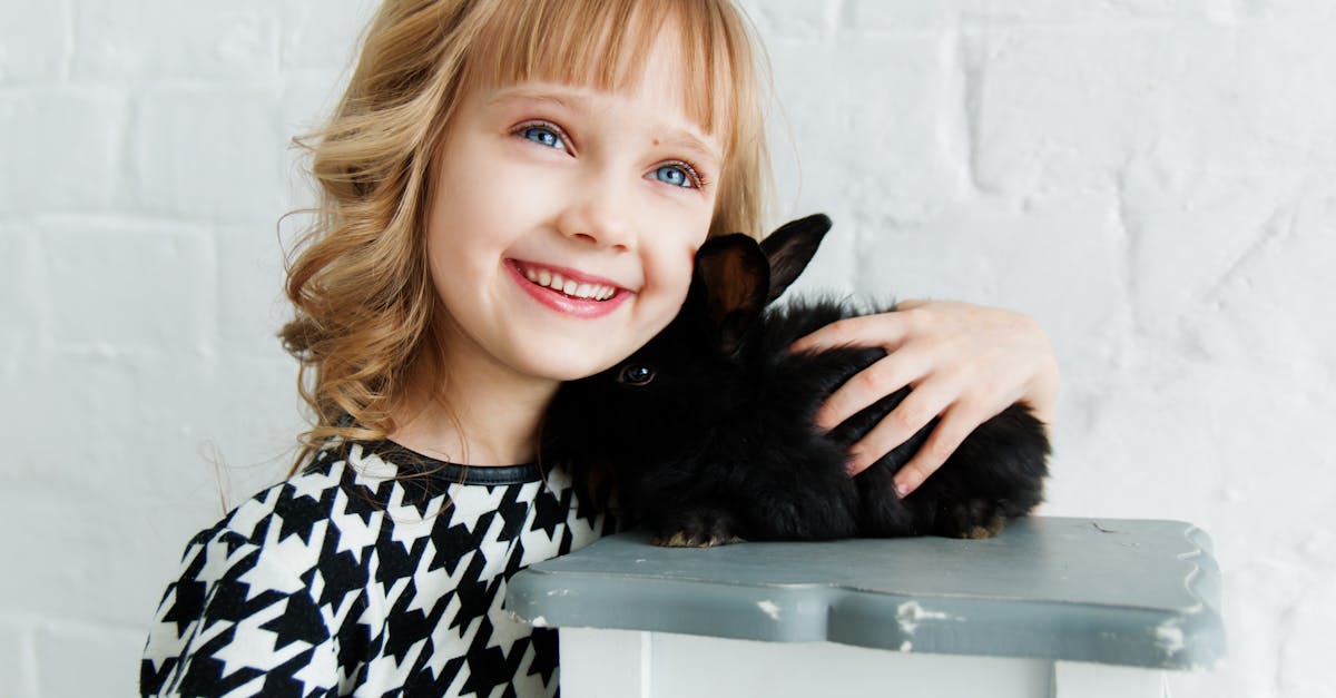 Girl Holding Black Rabbit