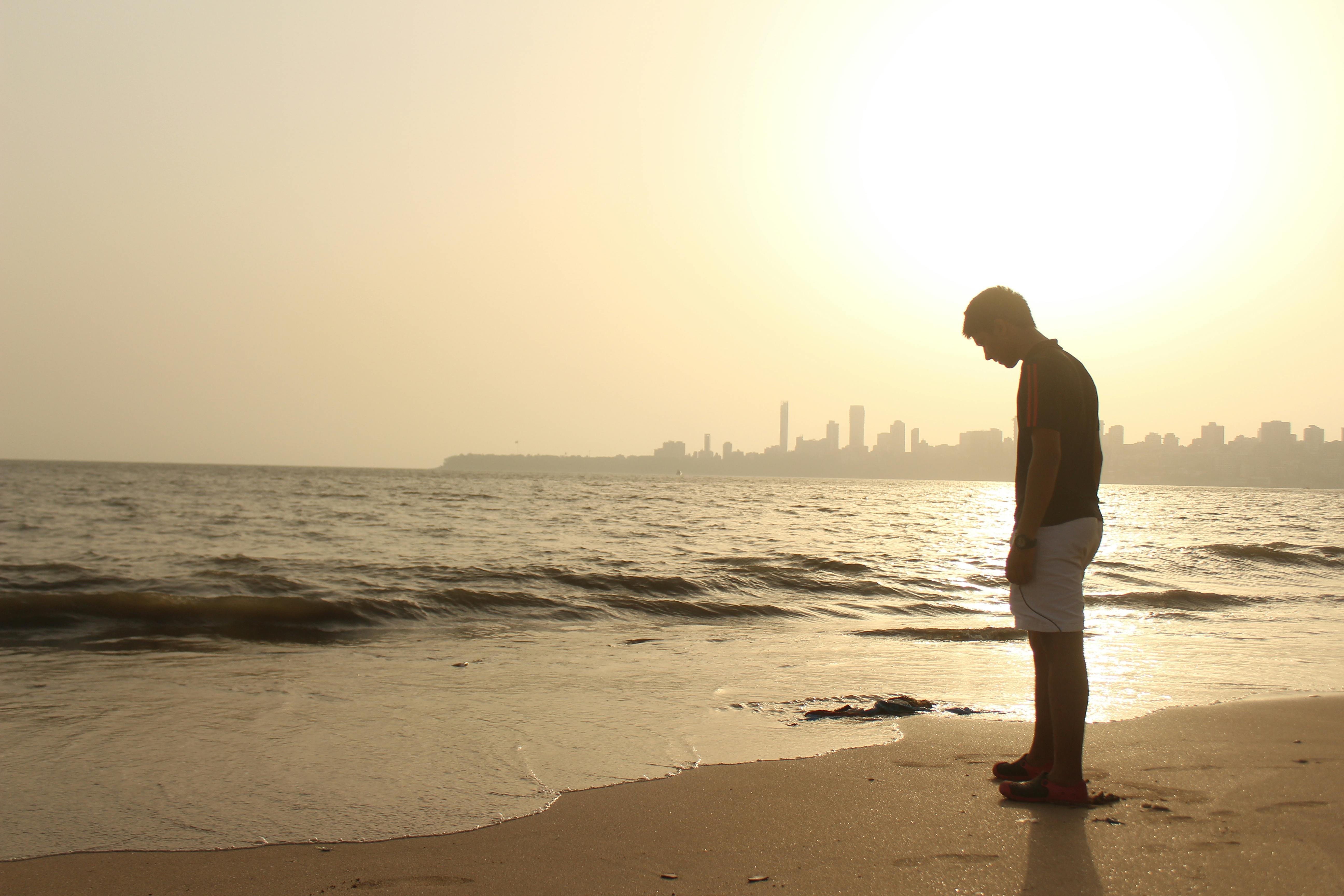 Man Standing On Seashore Free Stock Photo - 