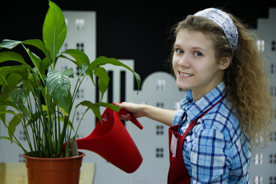 Woman Watering Plant