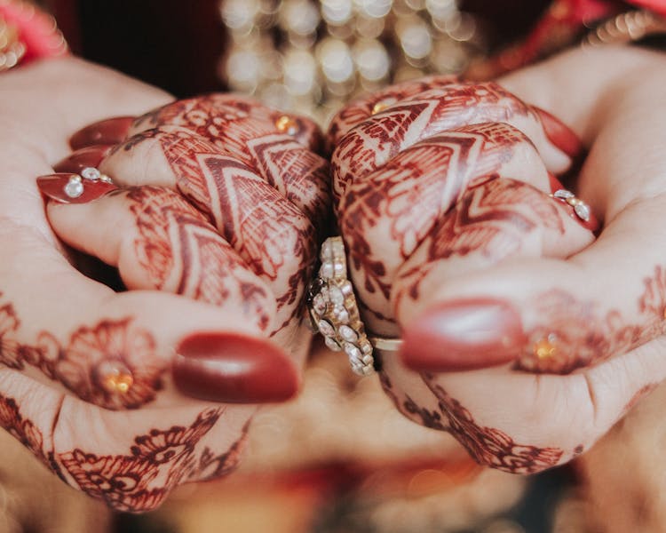 Close-up Of Bridal Henna Tattoos On Womans Hands 