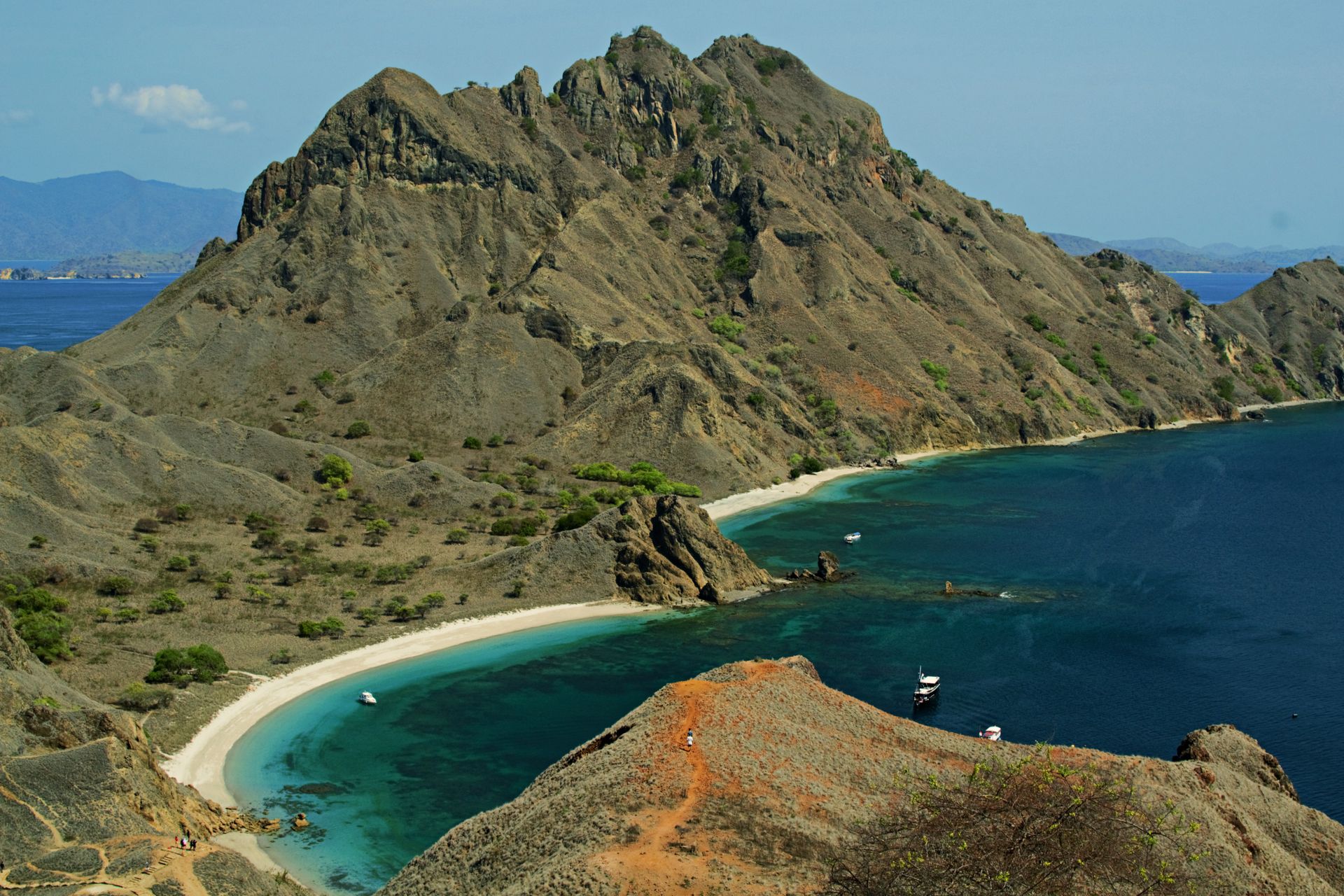 A breathtaking view of the unique topography and vibrant waters of Padar Island in Indonesia's Komodo National Park.