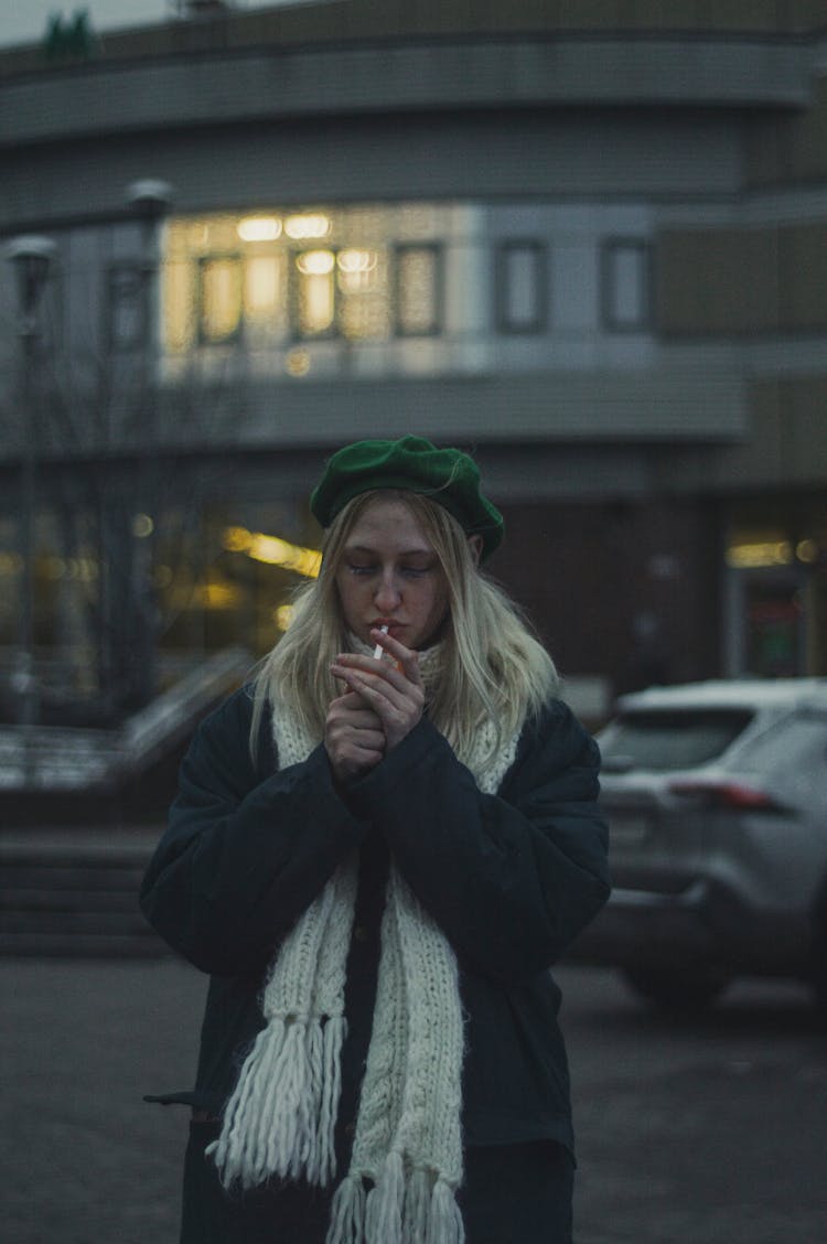 A Woman Lighting A Cigarette