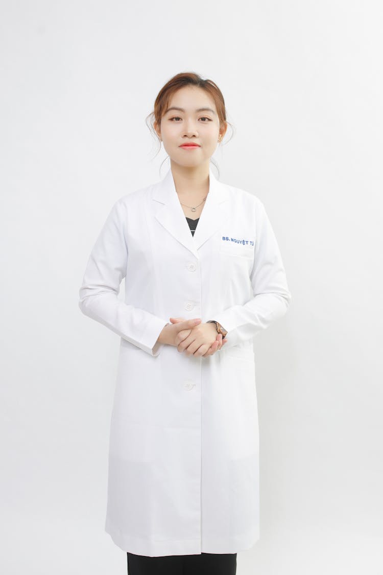 Woman In Medical Gown Staring