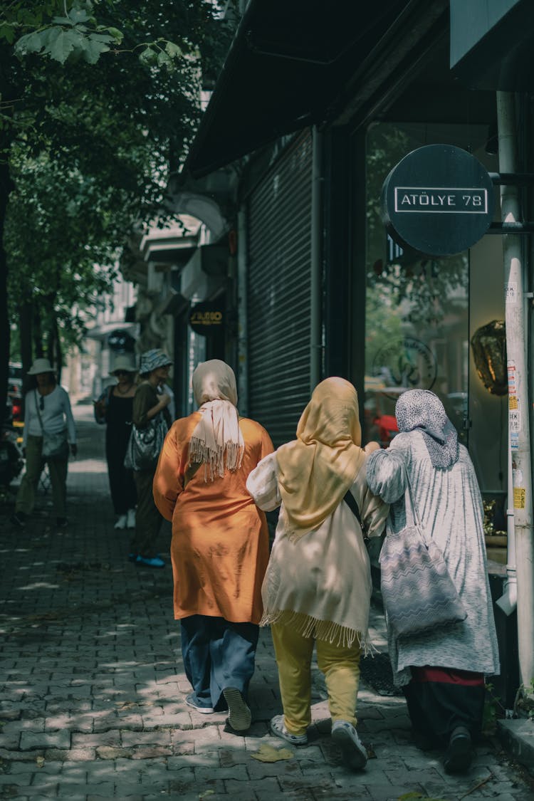 People Walking On The Sidewalk