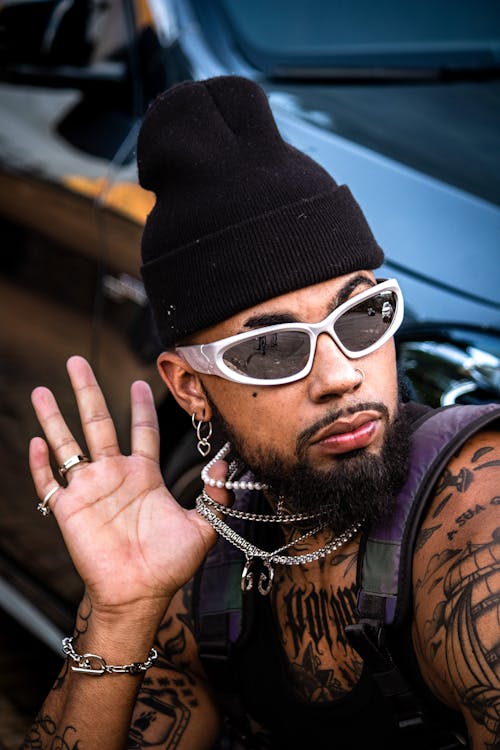 Tattooed Man Wearing Silver Necklaces 